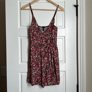 Floral romper with skirt tie front. New with tags
